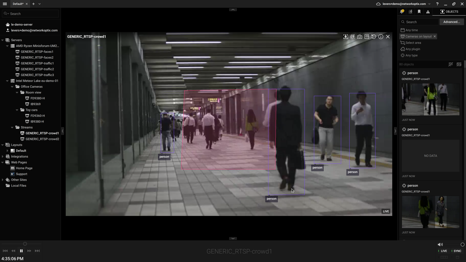 Live View of a crowded corridor showing a pink exclusive mask overlay over part of the frame, with detections still boxed in the rest of the frame