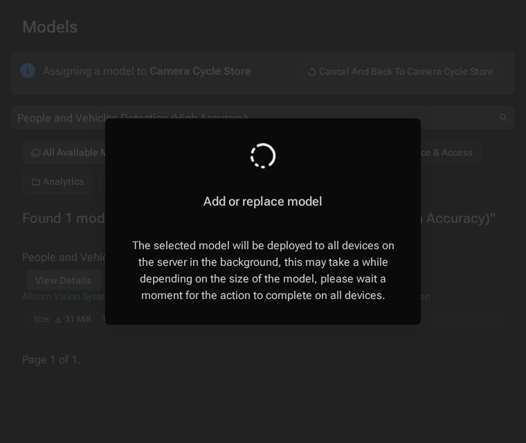 Add or replace model dialog showing the model deployment is in progress with a spinner